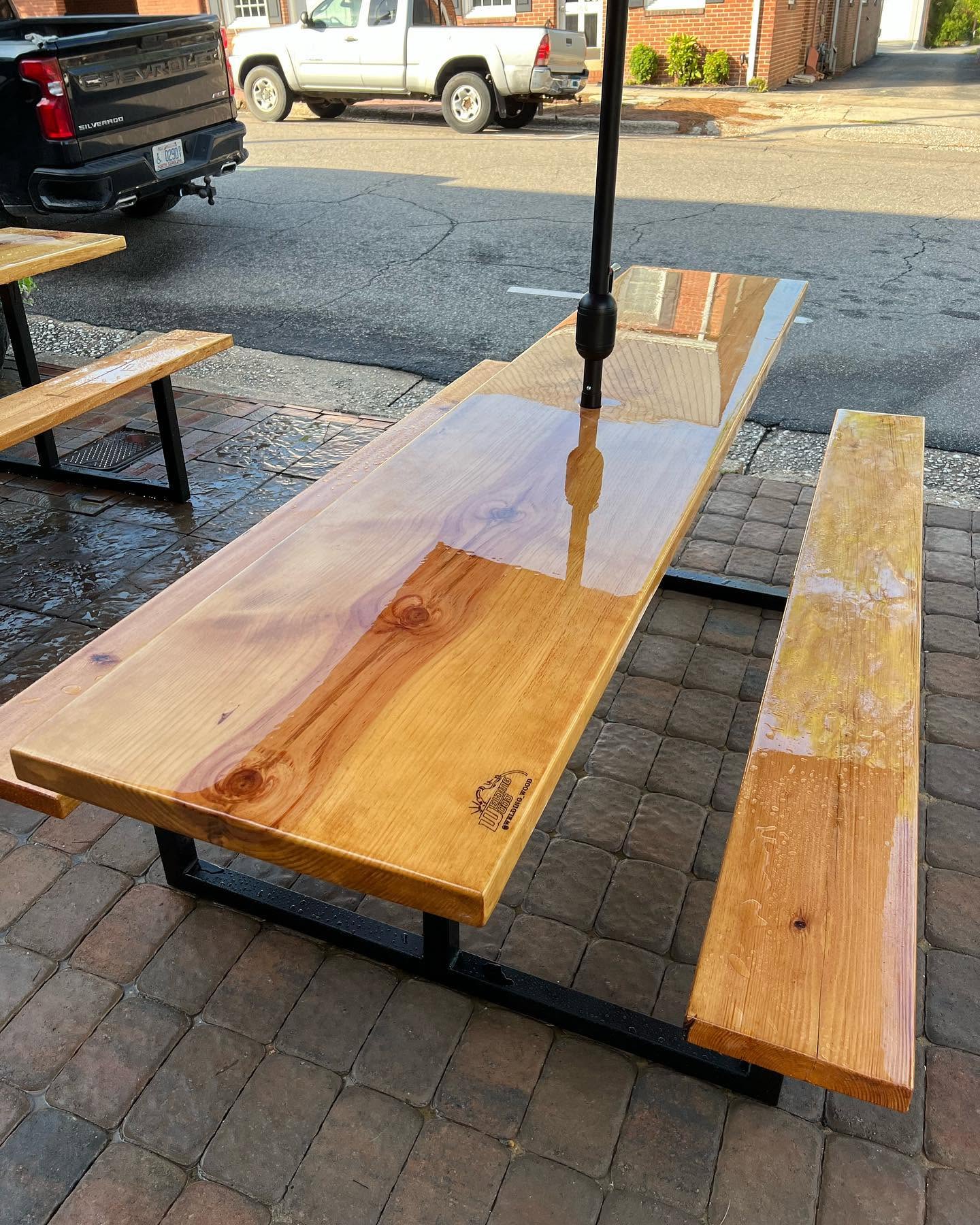 Live edge black walnut bar with red epoxy river at Hatchet Brewing Co.