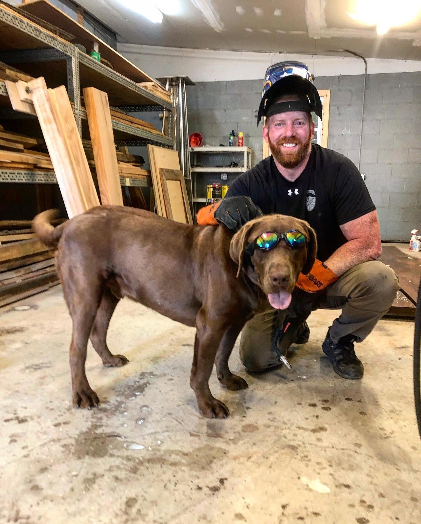 Shop dog keeping watch over a project.